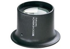 Small, round magnifier in black housing with small Eschenbach logo