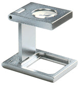 Load image into Gallery viewer, Small circular magnifying lens set in a rectangular metal casing, above a rectangular base.
