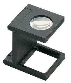 Small circular magnifying lens set in a black plastic casing, above a rectangular base.