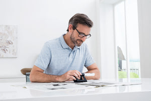 Man using Mobilux LED with mobase to read 