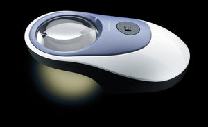 Powerlux, circular magnifier set in a blue, white and black casing. With LED light and on-off butter located on blue section. Ergonomically shaped to be easy to glide over a page.