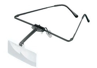 Magnifying lens attached to black carrier frame with black arm.