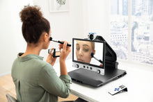 Load image into Gallery viewer, Woman using Vario DIGITAL 16 FHD advanced with mirror function to apply makeup.
