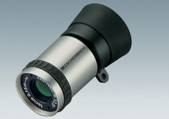 Silver cylindrical monocular with black eye-piece and Eschenbach logo printed onto silver housing.