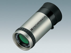 Silver cylindrical monocular with black eye-piece and Eschenbach logo printed onto silver housing, and black grip ring.
