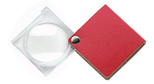 Circular magnifier with clear square housing, attached to red square case.