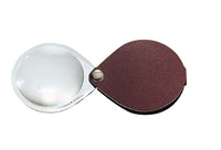 Circular magnifier inside clear oval setting, with attached fold-out burgundy