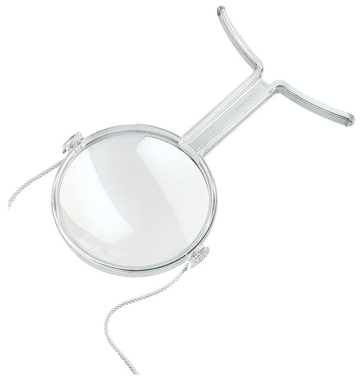 Clear plastic encasing large circular magnifying lens with a smaller, higher powered magnifying lens below. Clear feet designed to sit on chest and neck strap are shown.