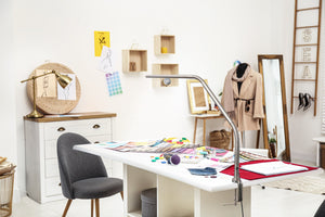 Fashion design studio with Slimline table lamp on a desk.