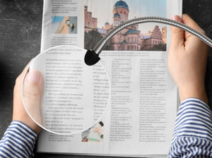 Daylight's magnifying arm , placed over a travel book