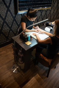 Daylight's Slimline Floor-standing lamp being used in a nail salon.